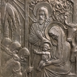 Emil Cedercreutzin reliefi vuodelta 1926, jossa paimenet tai tietäjät kumartavat Jeesuslasta. Kuvan lapsi e...